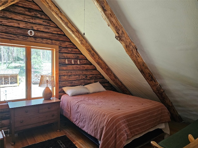 bedroom featuring lofted ceiling with beams, log walls, and dark hardwood / wood-style floors