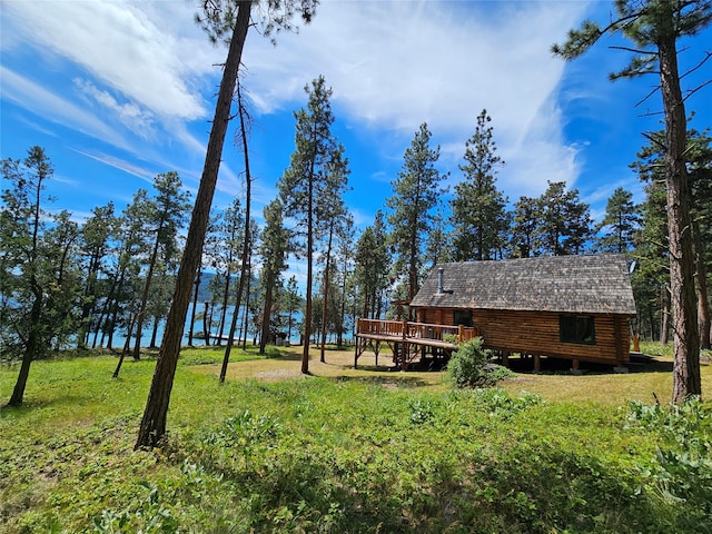 view of yard featuring a wooden deck