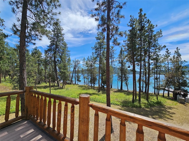 wooden terrace featuring a water view