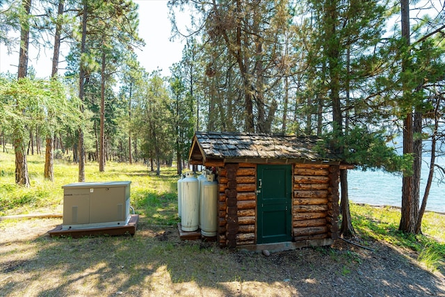 view of outbuilding featuring a water view