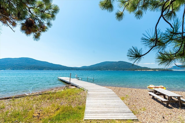 dock area with a water and mountain view