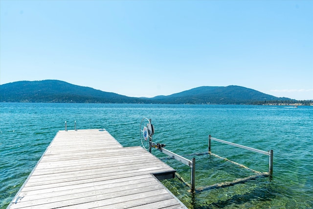 dock area featuring a water and mountain view