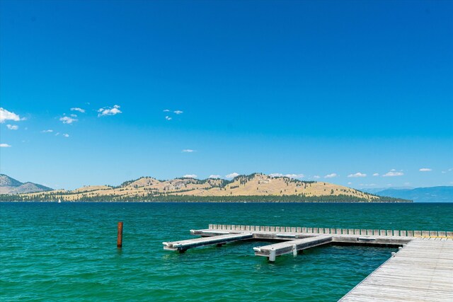 dock area with a water and mountain view