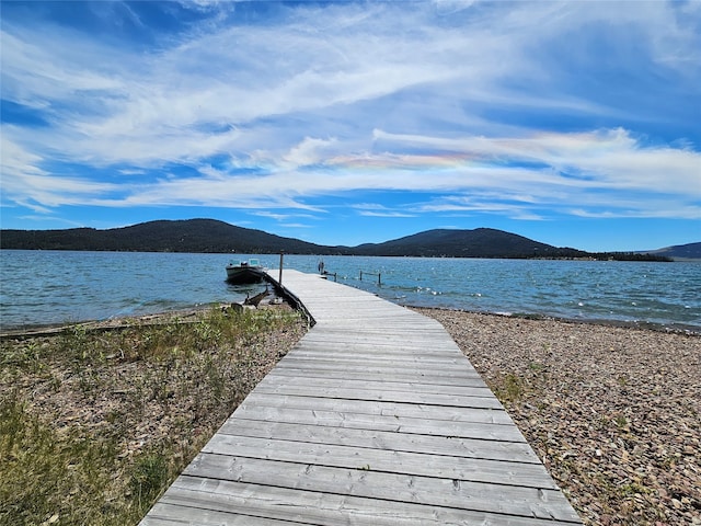 dock area featuring a water and mountain view