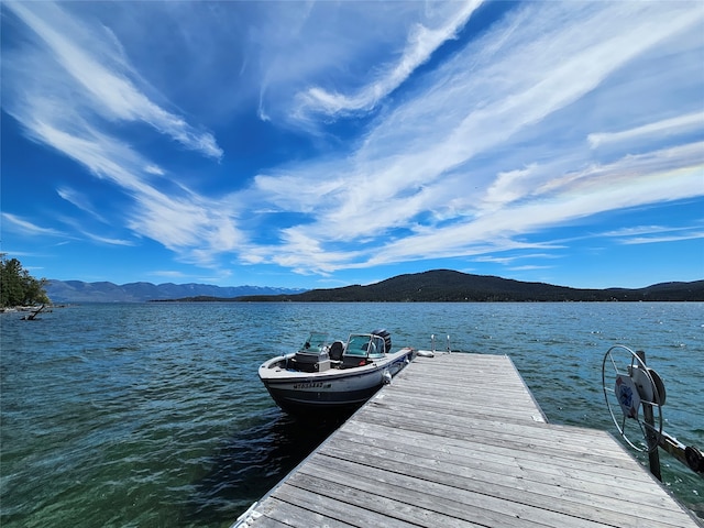 dock area with a water and mountain view