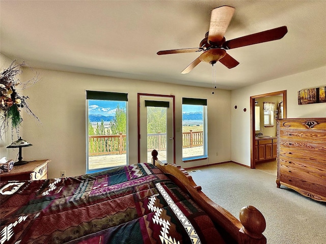 bedroom with baseboards, a ceiling fan, connected bathroom, light colored carpet, and access to exterior