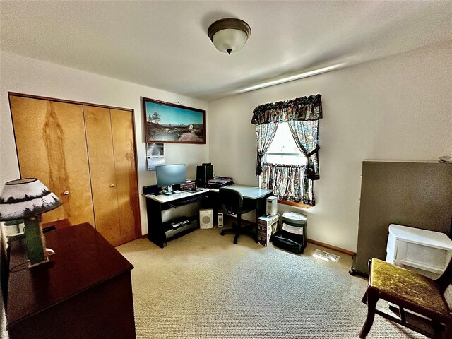 workout room featuring carpet and a textured ceiling