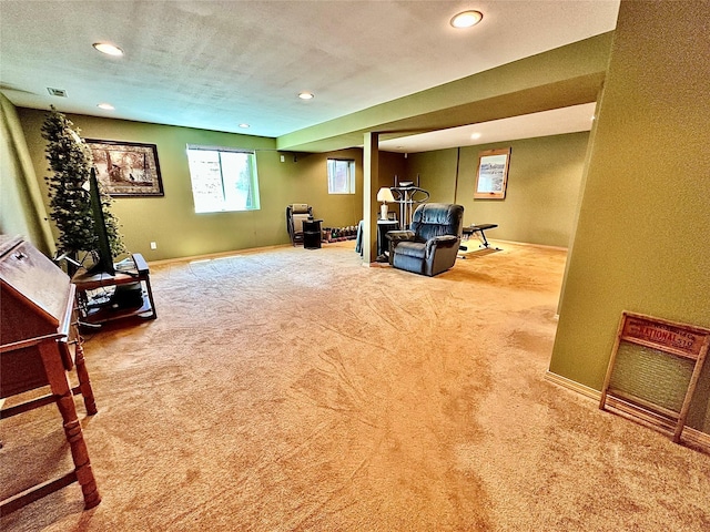 living area with carpet, a textured ceiling, baseboards, and recessed lighting