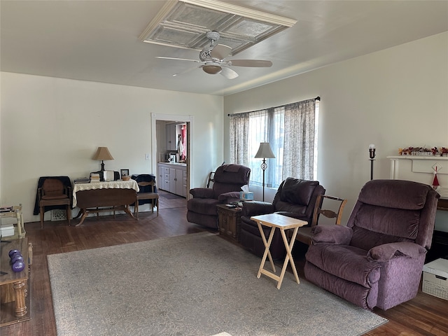 living room with ceiling fan and dark wood-type flooring