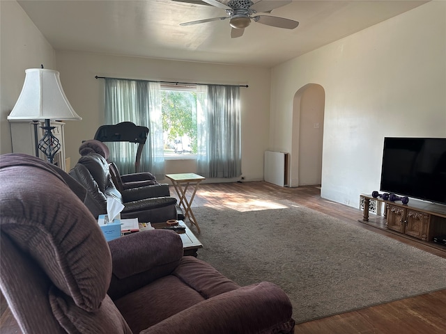 living room featuring hardwood / wood-style flooring and ceiling fan