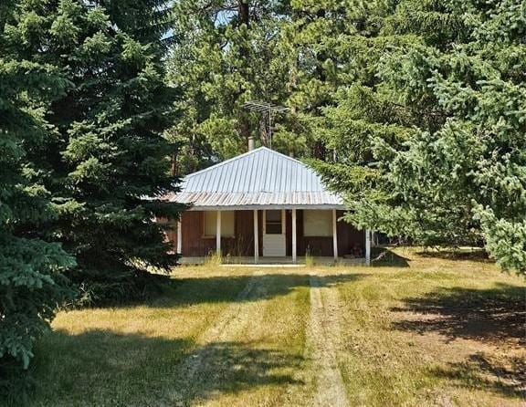 view of outbuilding with a yard