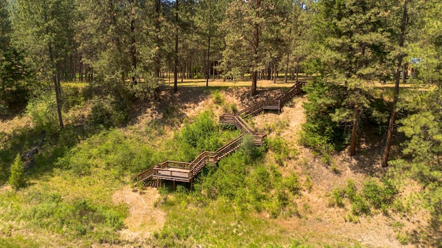 exterior space featuring a wooded view