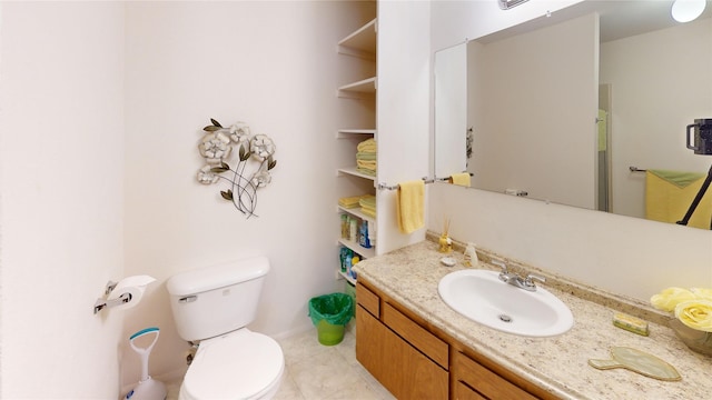 bathroom featuring tile patterned floors, vanity, and toilet