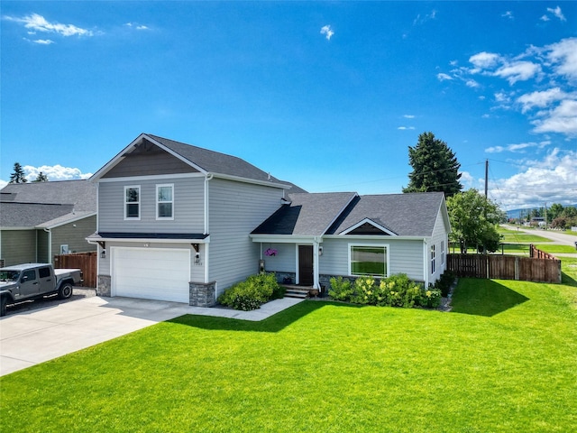 view of front of house featuring a garage and a front lawn