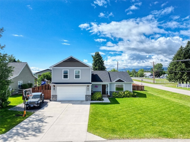 view of front of property featuring a garage and a front lawn