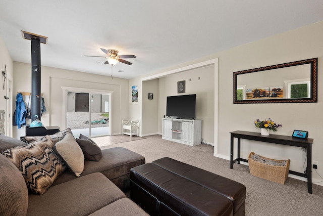 carpeted living room with ceiling fan