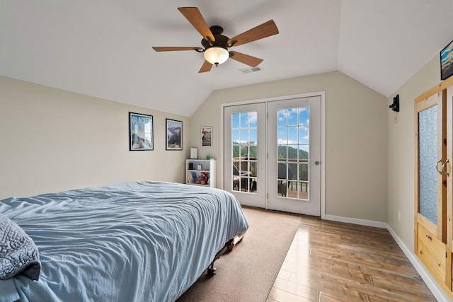 bedroom featuring lofted ceiling, hardwood / wood-style flooring, ceiling fan, and access to outside