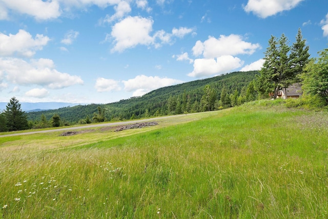 property view of mountains featuring a rural view