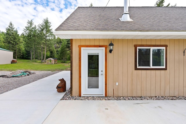 doorway to property with a patio and a yard