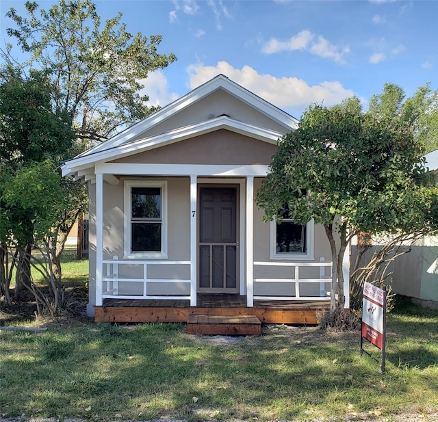 bungalow with a front yard