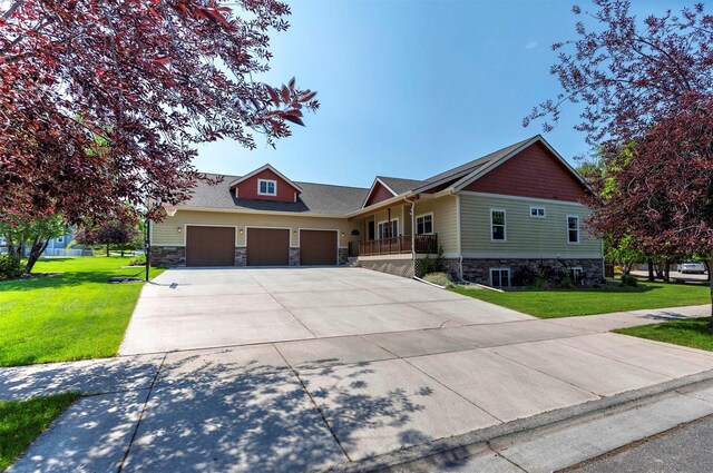 view of front facade featuring a garage and a front lawn