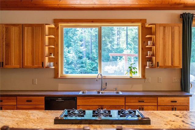 kitchen featuring sink, gas cooktop, light stone countertops, and black dishwasher