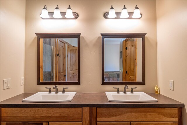 bathroom with walk in shower and vanity