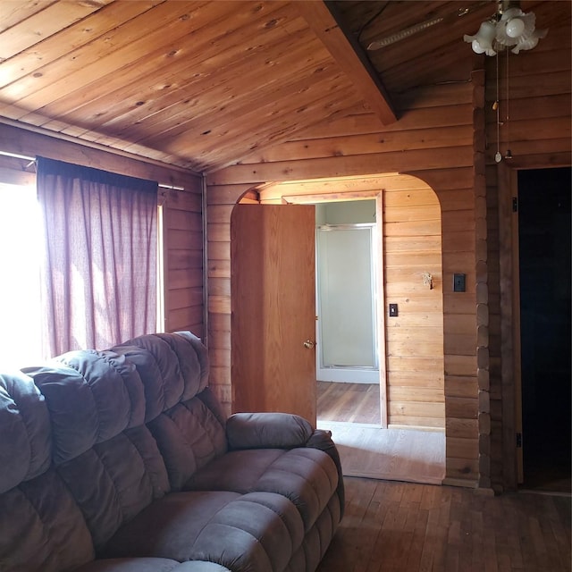 living room with a ceiling fan, hardwood / wood-style floors, wood ceiling, arched walkways, and lofted ceiling