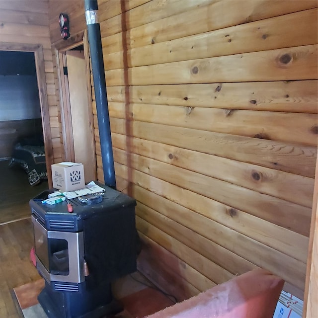 interior space featuring hardwood / wood-style flooring and a wood stove