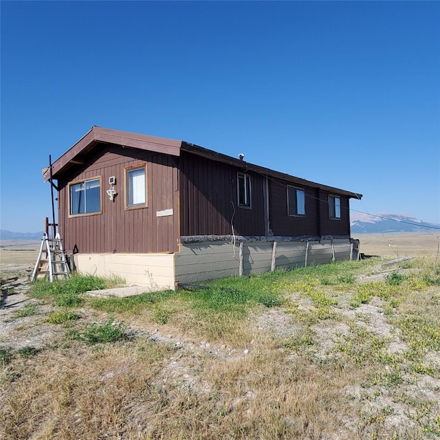 view of home's exterior with a mountain view