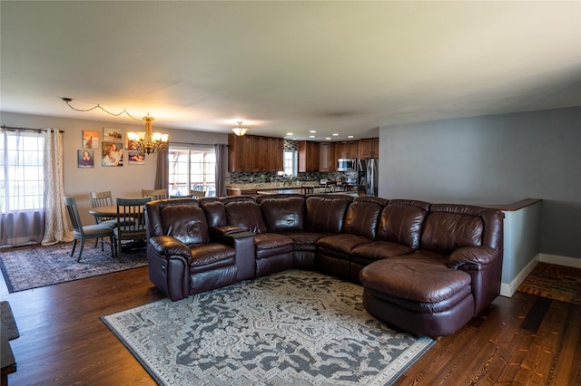 700 Stone St, Kalispell, MT 59901 - living room featuring a chandelier, dark wood-style flooring, recessed lighting, and baseboards