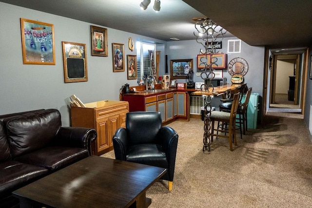 bar featuring a sink, light colored carpet, and visible vents