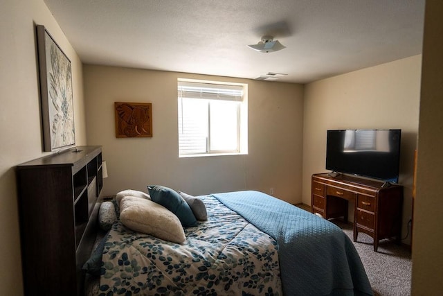 bedroom featuring carpet flooring and visible vents