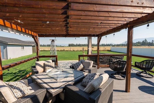 view of patio featuring fence, a pergola, an outdoor living space, and a deck