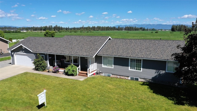 700 Stone St, Kalispell, MT 59901 - ranch-style house with concrete driveway, a front yard, and a garage