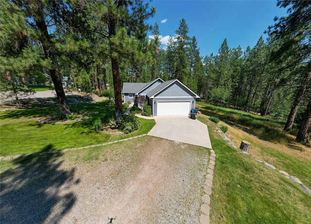 ranch-style home featuring a garage and a front lawn