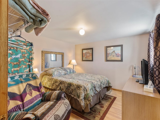 bedroom with light hardwood / wood-style floors