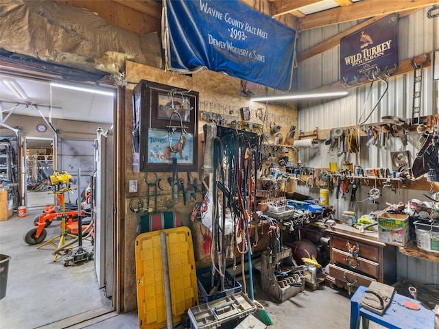 misc room featuring a workshop area and concrete flooring