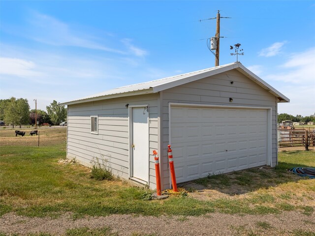 garage with a yard