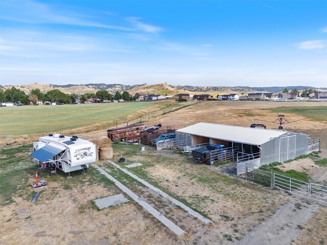 birds eye view of property featuring a rural view