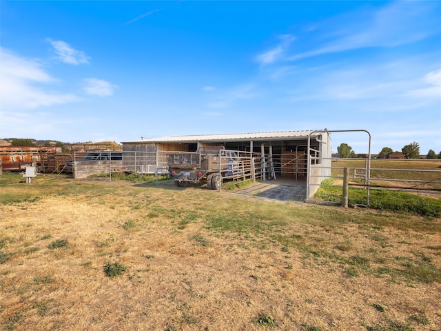 view of outbuilding featuring a rural view