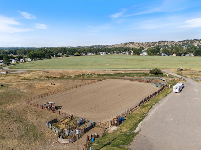 birds eye view of property with a rural view