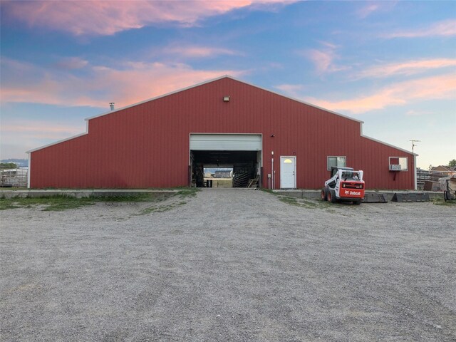 outdoor structure at dusk with a garage