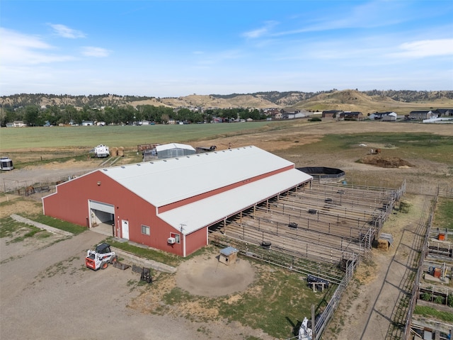 birds eye view of property featuring a rural view and a mountain view