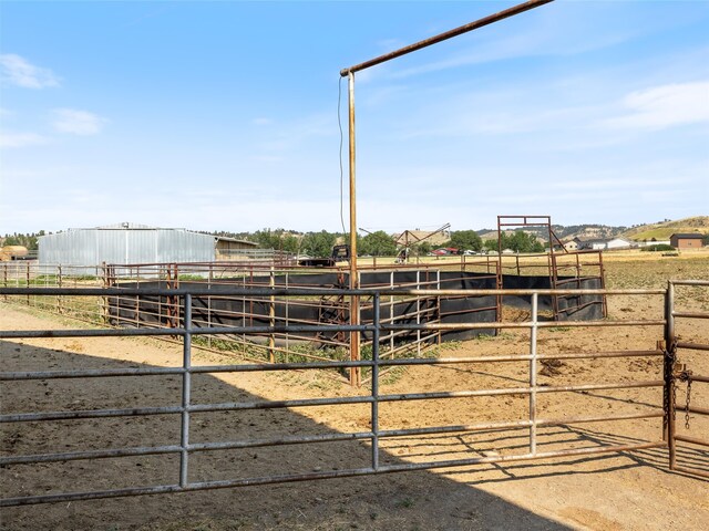 view of horse barn with an outbuilding