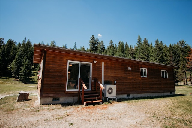 view of front of property with ac unit