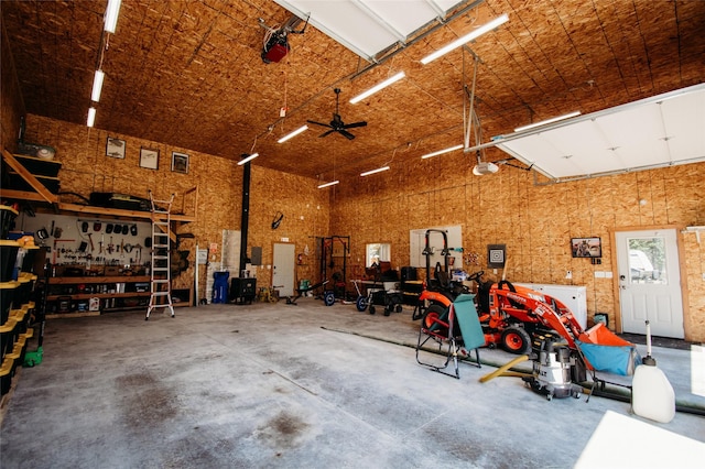 garage with a workshop area and ceiling fan