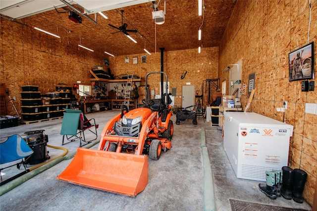 garage featuring a garage door opener and ceiling fan