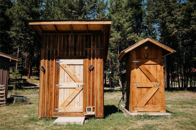 view of outbuilding with a lawn