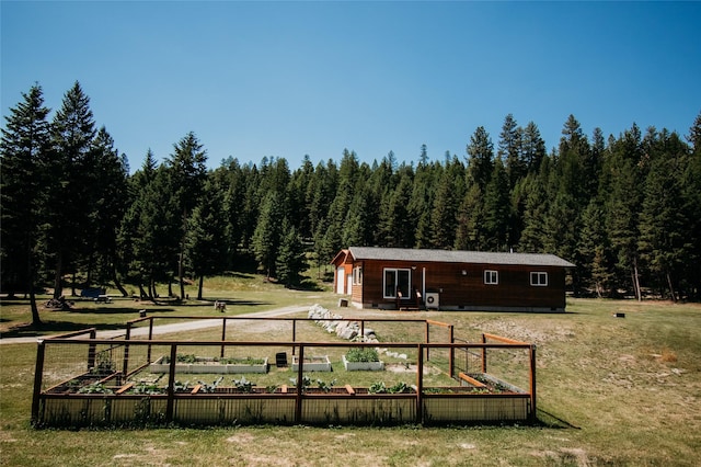 back of house with a lawn